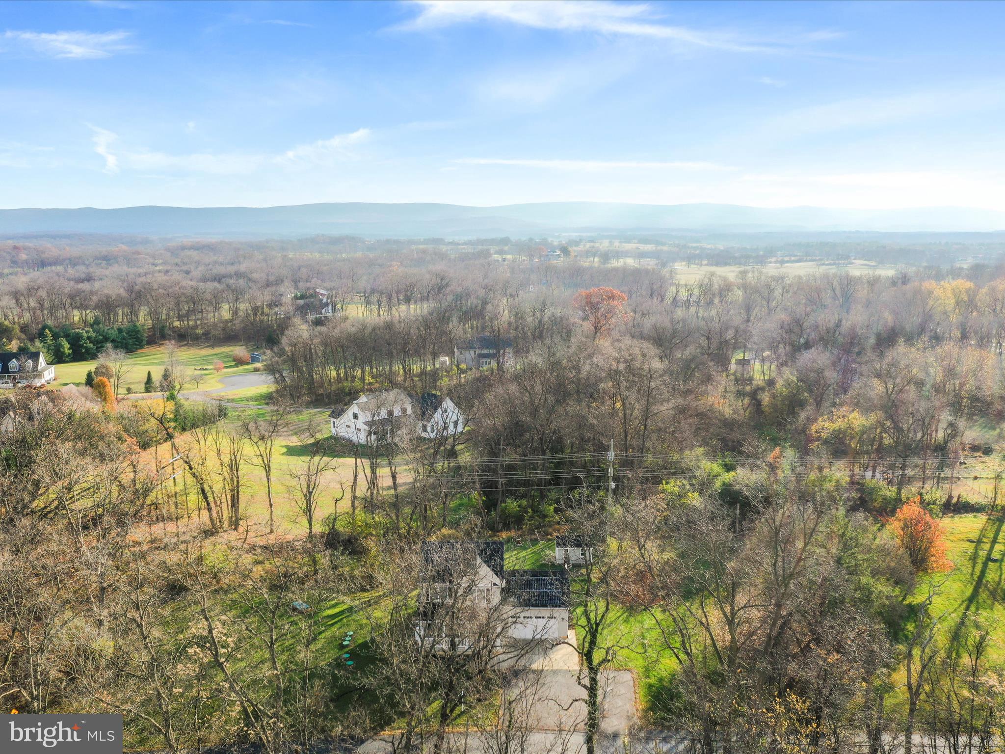 1150 Lewisville Road Berryville, VA 22611 - Photo 50 of 50 a view of a lake with mountains in the background