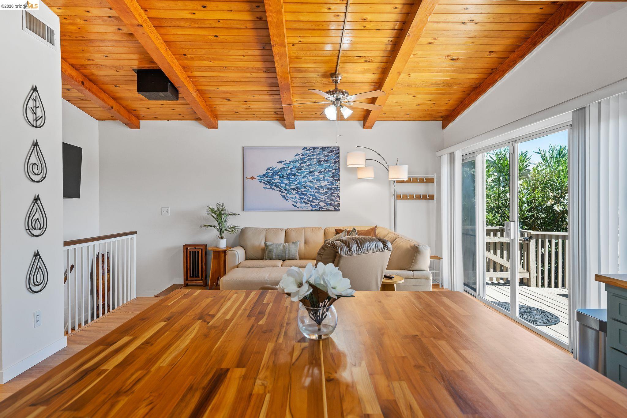 1704 Taylor Road Bethel Island, CA 94511 - Photo 31 of 73 Warm wood-finish ceiling with exposed beams and a ceiling fan