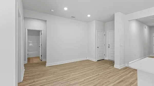a view of hallway with wooden floor