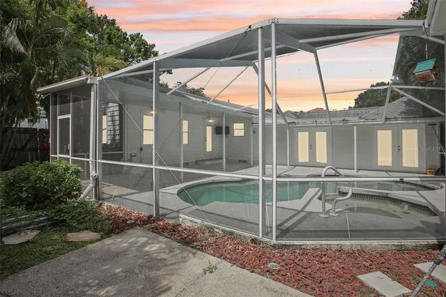 a view of pool with a backyard