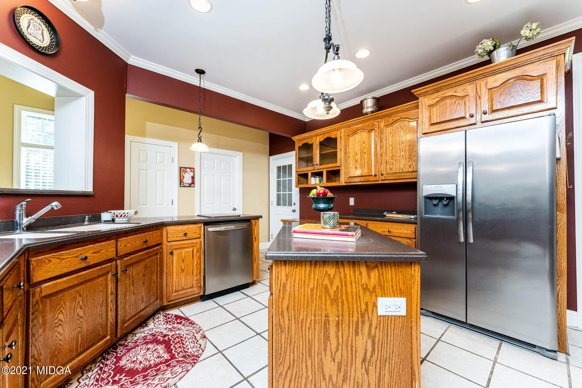 3368 Tidwell Road Lizella, GA 31052 - Photo 14 of 43 a kitchen with stainless steel appliances granite countertop a sink a stove and refrigerator
