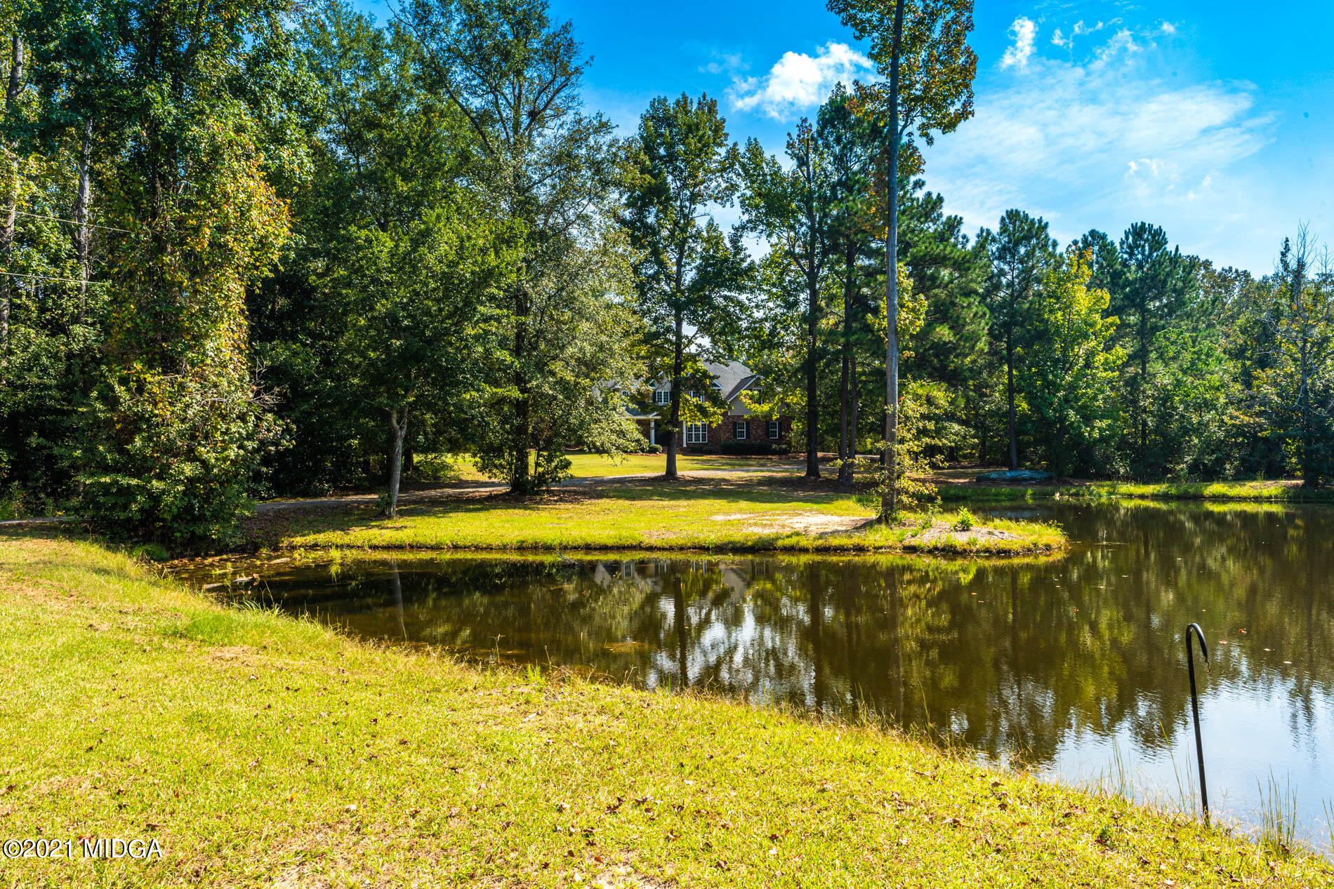 3368 Tidwell Road Lizella, GA 31052 - Photo 3 of 43 a view of swimming pool with an outdoor space and seating area