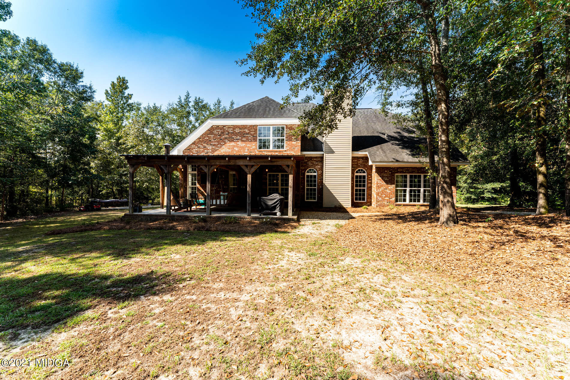 3368 Tidwell Road Lizella, GA 31052 - Photo 40 of 43 a front view of a house with a yard porch and seating