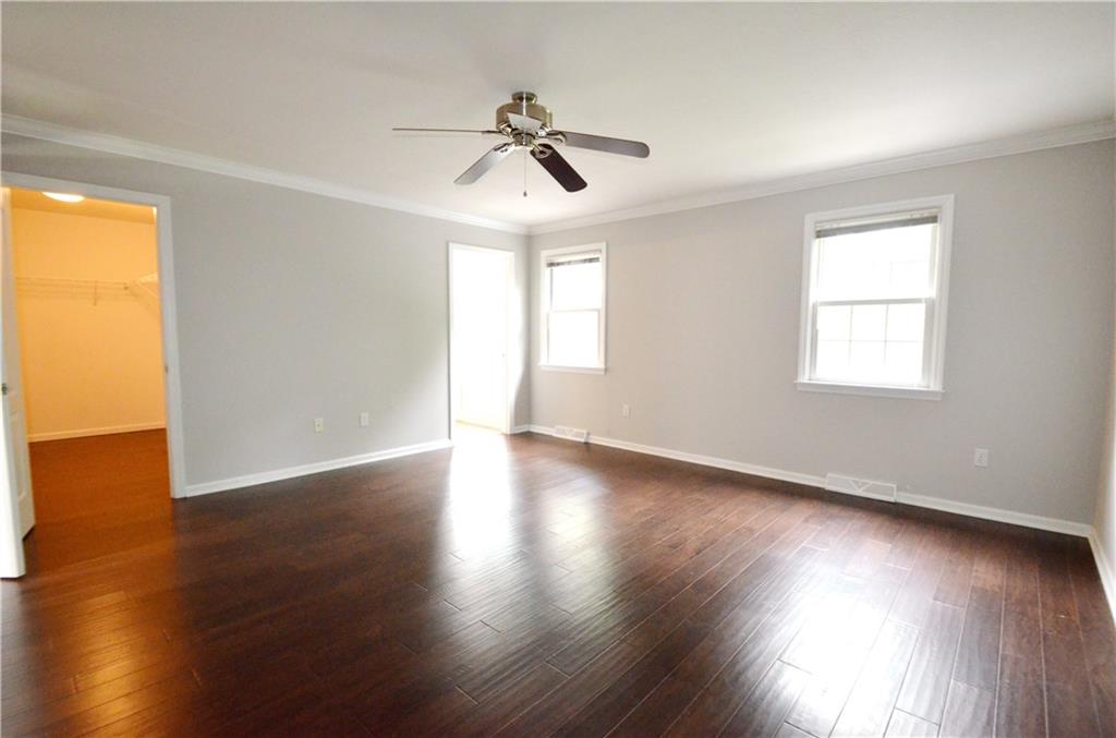 603 Heritage Place Cranberry Township, PA 16066 - Photo 14 of 25 a view of an empty room with wooden floor and a window
