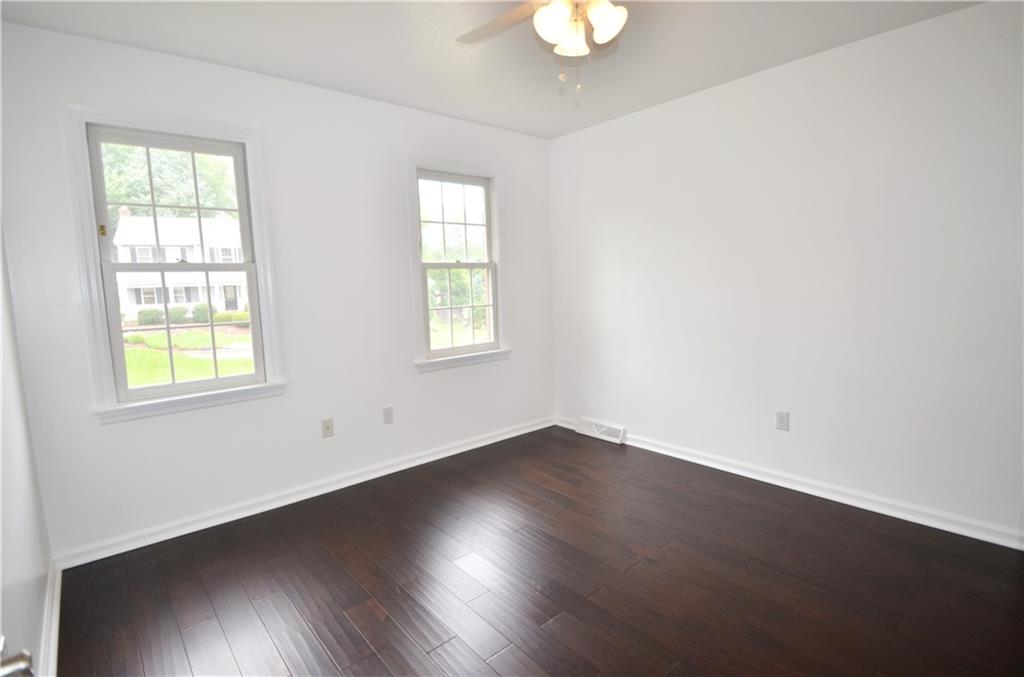 603 Heritage Place Cranberry Township, PA 16066 - Photo 18 of 25 an empty room with wooden floor and windows