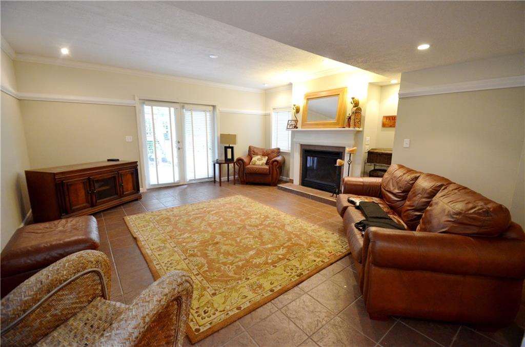 603 Heritage Place Cranberry Township, PA 16066 - Photo 21 of 25 a living room with furniture large window and fireplace