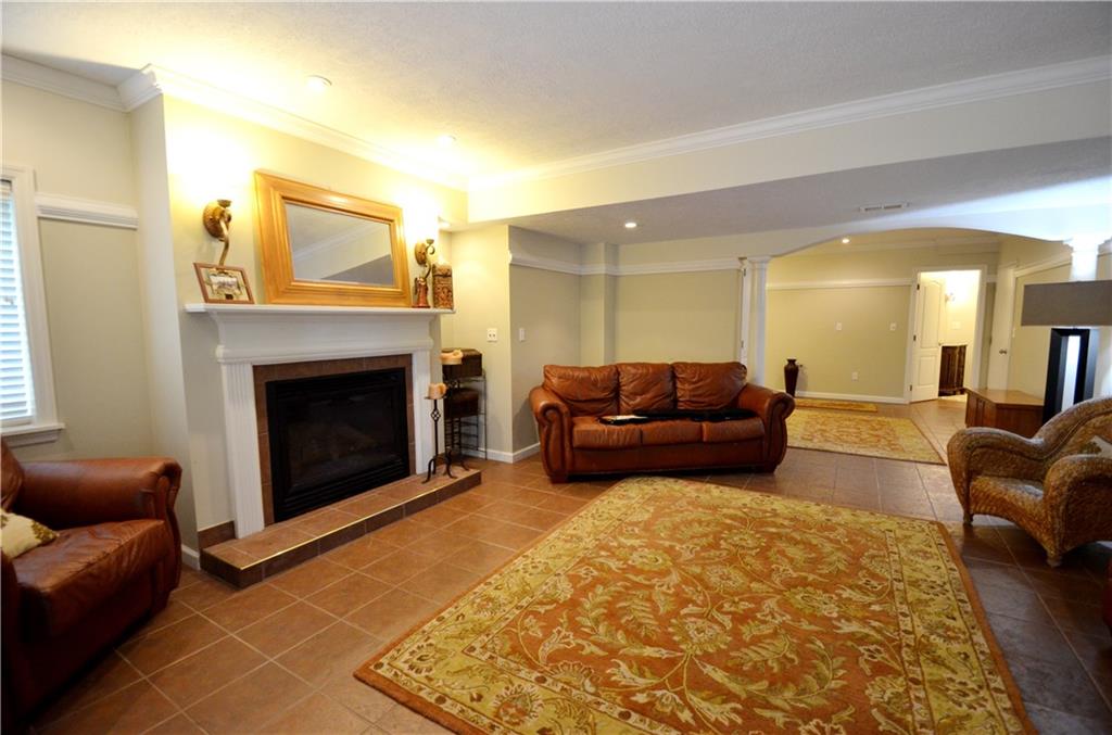 603 Heritage Place Cranberry Township, PA 16066 - Photo 22 of 25 a living room with furniture and a fireplace