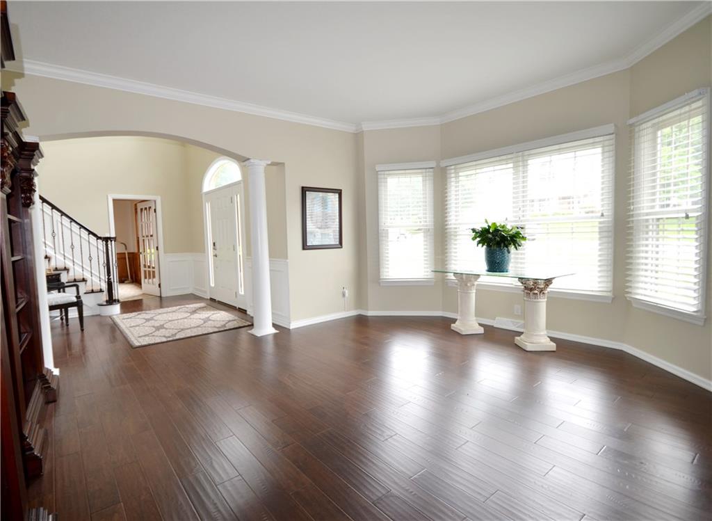 603 Heritage Place Cranberry Township, PA 16066 - Photo 3 of 25 a view of an empty room with wooden floor and a window