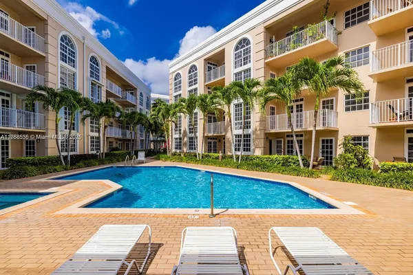 a view of a building with a swimming pool