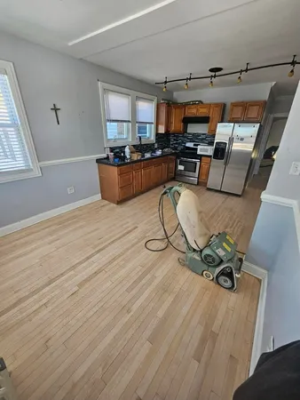 a view of a livingroom with furniture and a window