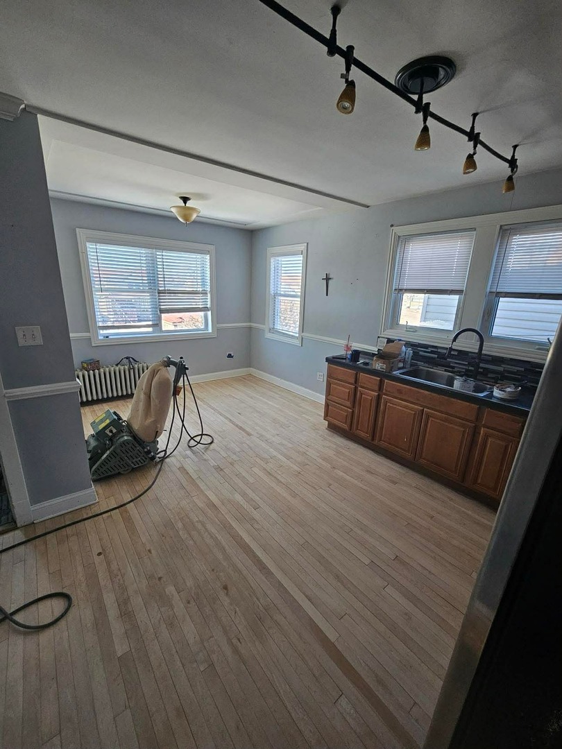 1630 Home Avenue, Unit 2 Berwyn, IL 60402 - Photo 3 of 7 a view of a livingroom with furniture wooden floor and windows
