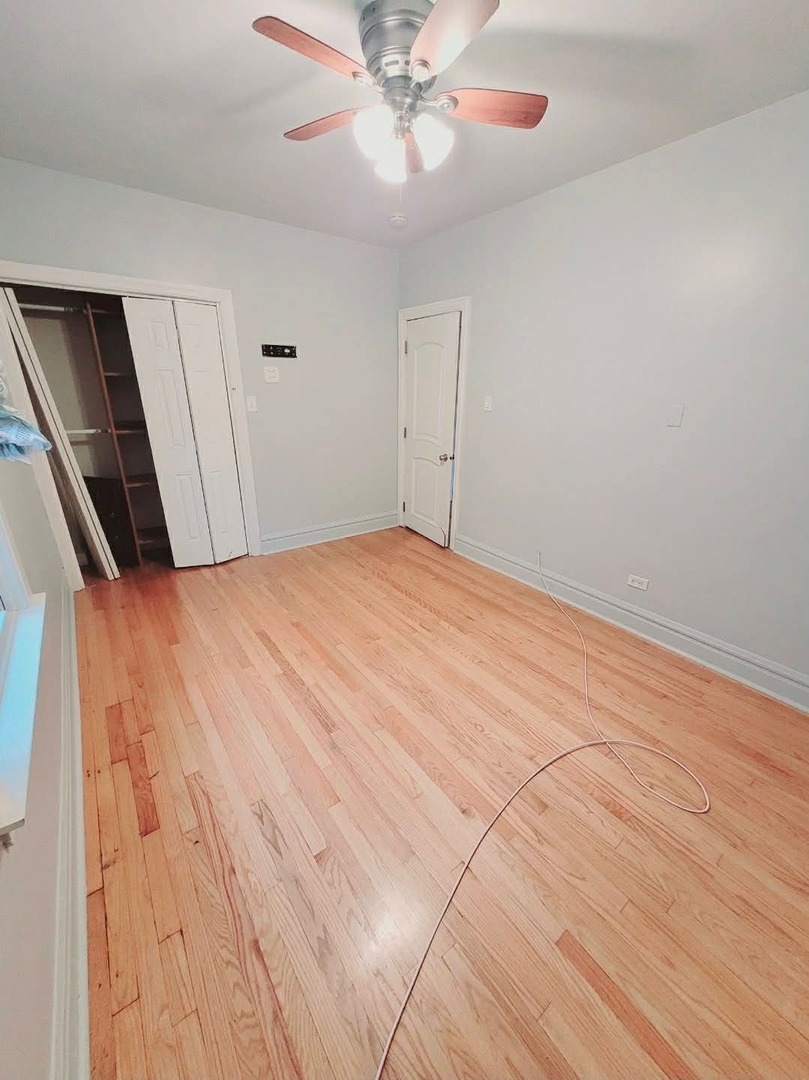 1630 Home Avenue, Unit 2 Berwyn, IL 60402 - Photo 4 of 7 a view of empty room with wooden floor
