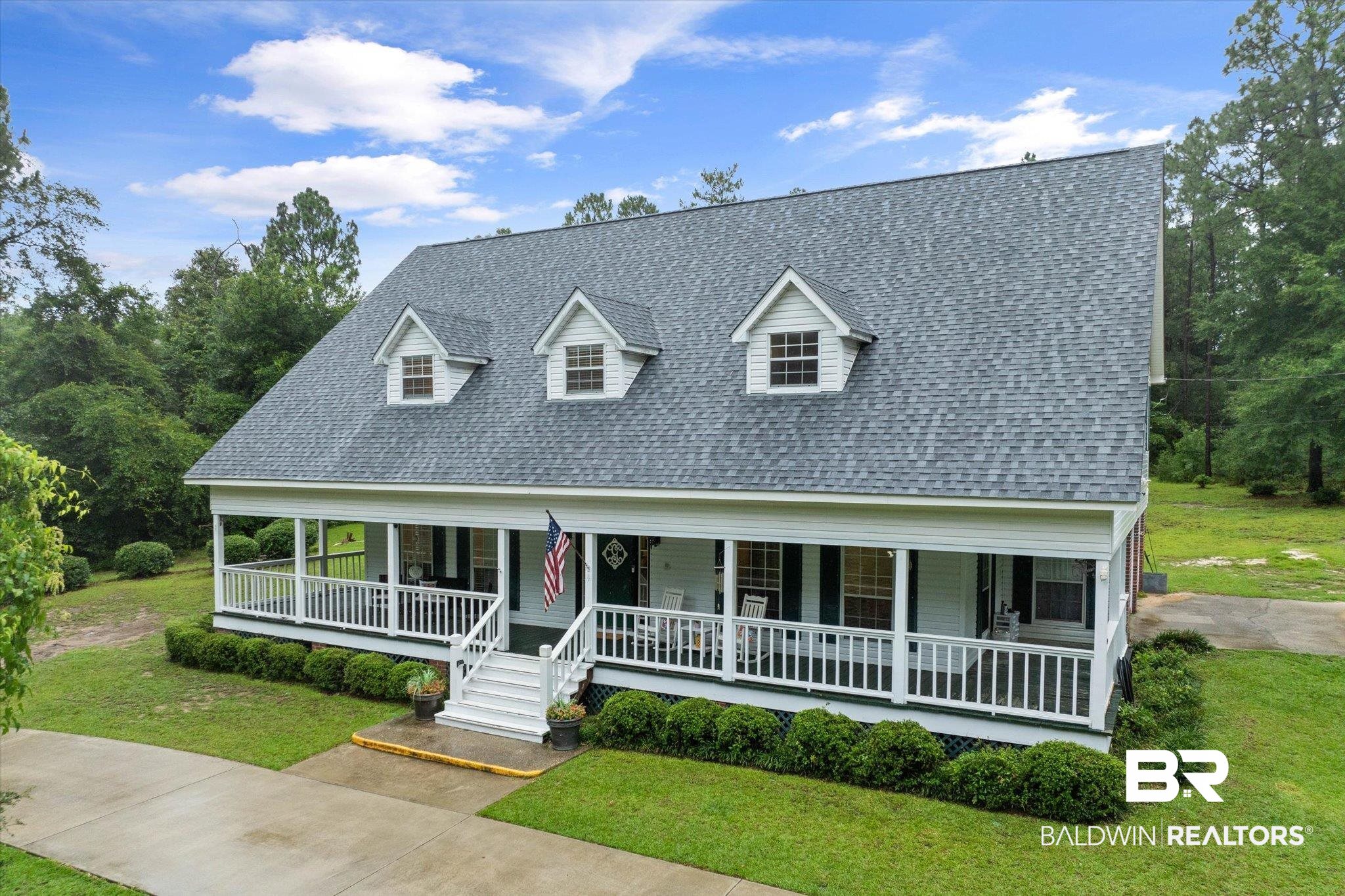 2300 Radcliff Road Saraland, AL 36571 - Photo 1 of 56 View of front of property with covered porch, a shingled roof, and a front lawn