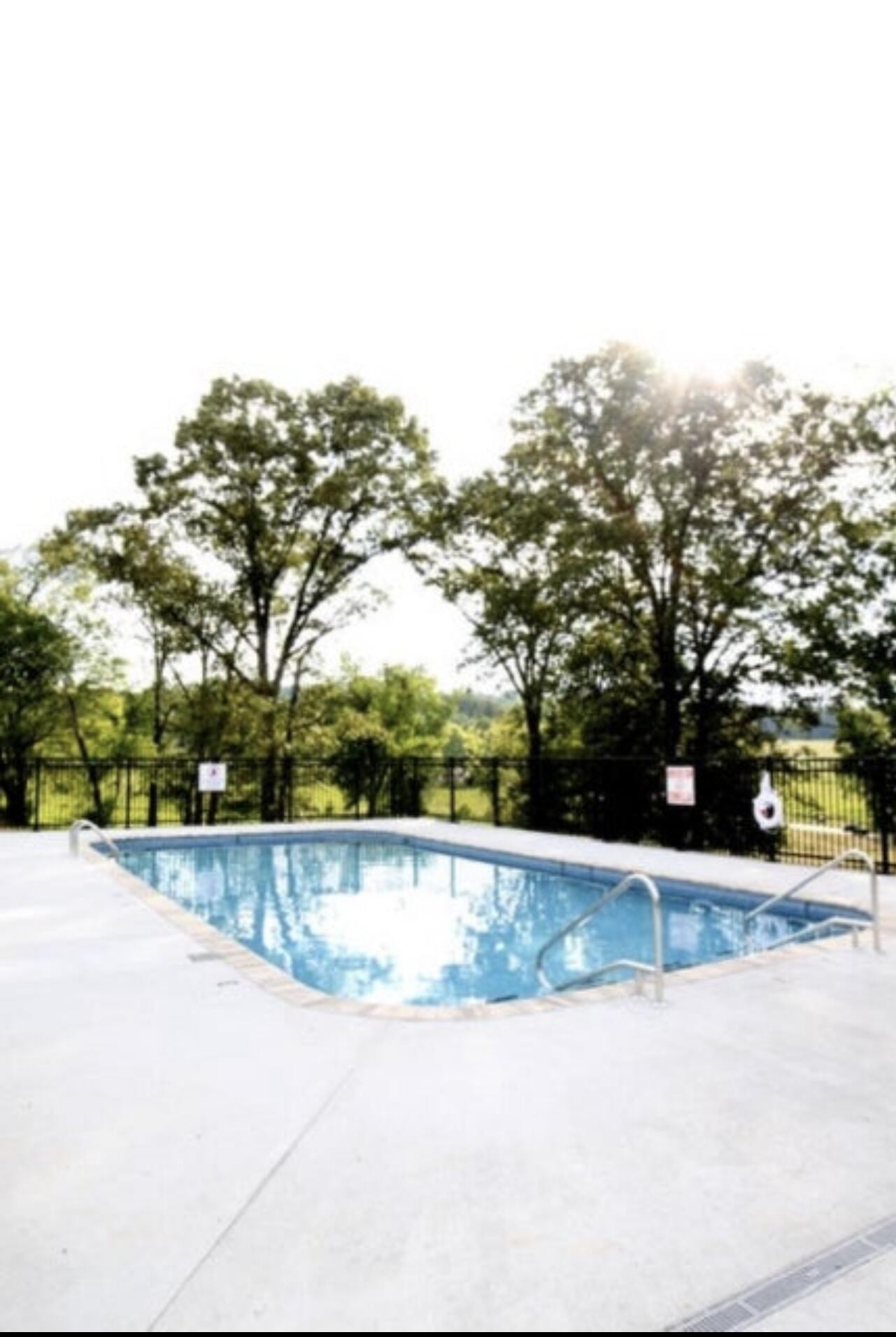 0 Castaway Lane Jasper, TN 37347 - Photo 17 of 17 a view of a swimming pool with an outdoor space and seating area