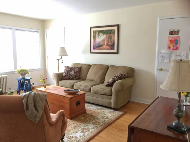 a living room with furniture and a window