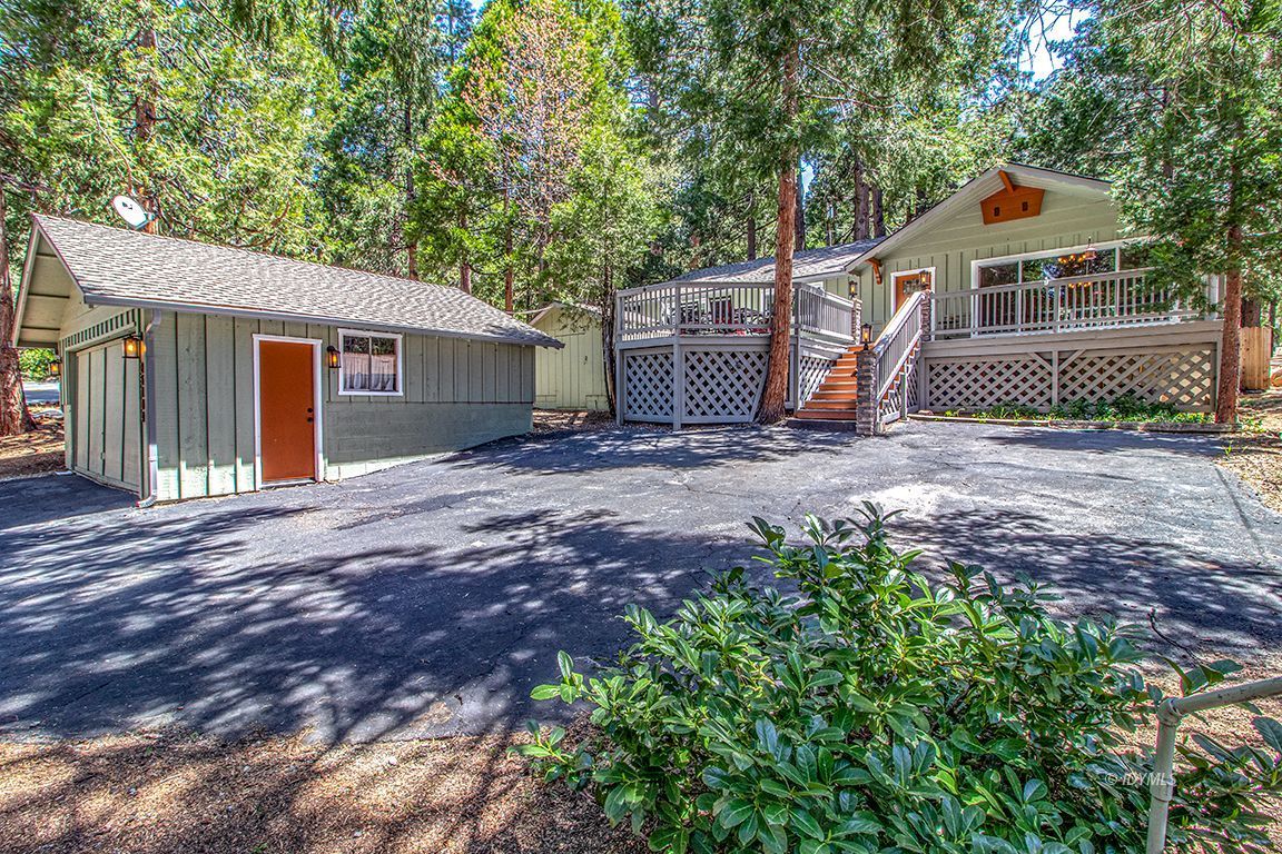 25104 Fern Valley Road Idyllwild, CA 92549 - Photo 1 of 55 a view of a house with a yard and large tree