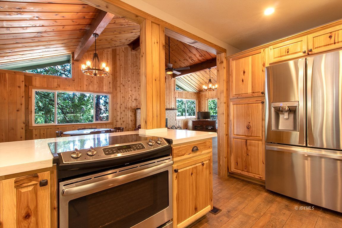 25104 Fern Valley Road Idyllwild, CA 92549 - Photo 12 of 55 a kitchen that has a stove and a refrigerator