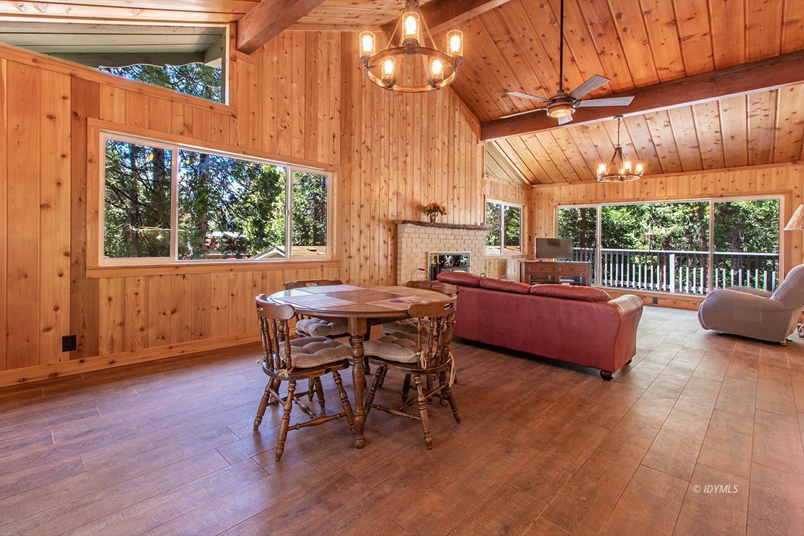 25104 Fern Valley Road Idyllwild, CA 92549 - Photo 16 of 55 a view of a patio with a table chairs and a backyard