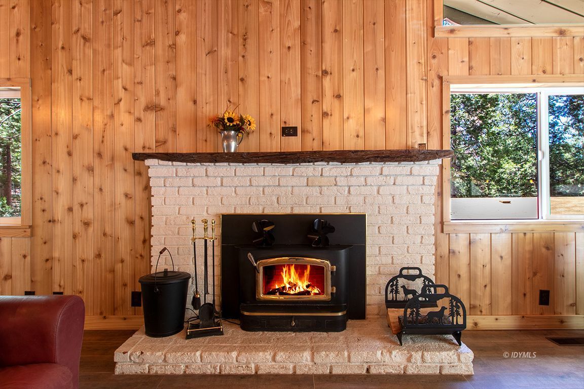 25104 Fern Valley Road Idyllwild, CA 92549 - Photo 19 of 55 a living room with furniture and a fireplace