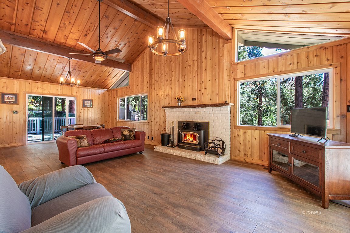 25104 Fern Valley Road Idyllwild, CA 92549 - Photo 3 of 55 a living room with furniture and a fireplace