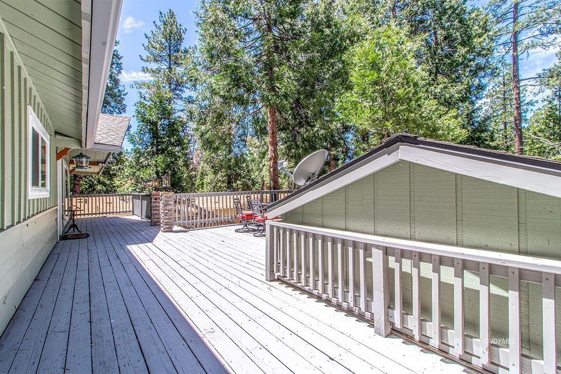 25104 Fern Valley Road Idyllwild, CA 92549 - Photo 31 of 55 a balcony with wooden floor and fence