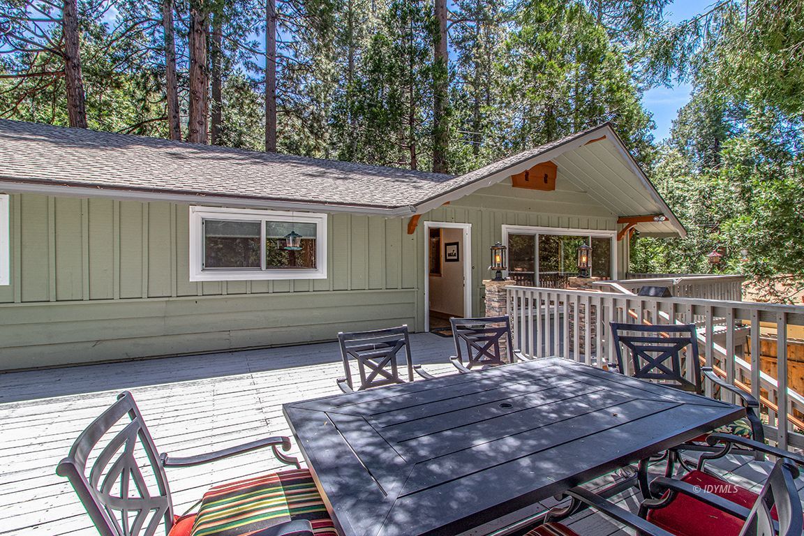 25104 Fern Valley Road Idyllwild, CA 92549 - Photo 33 of 55 a view of a wooden chairs and table on the deck