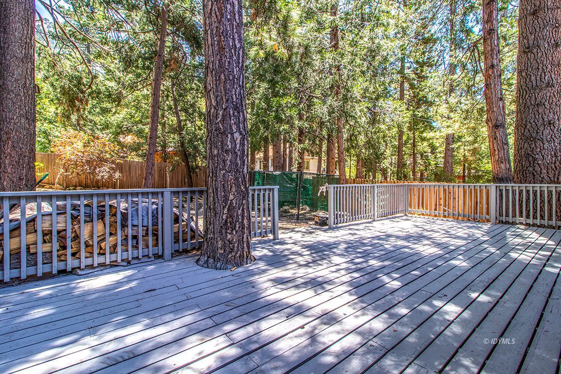 25104 Fern Valley Road Idyllwild, CA 92549 - Photo 36 of 55 a view of backyard with wooden floor and trees