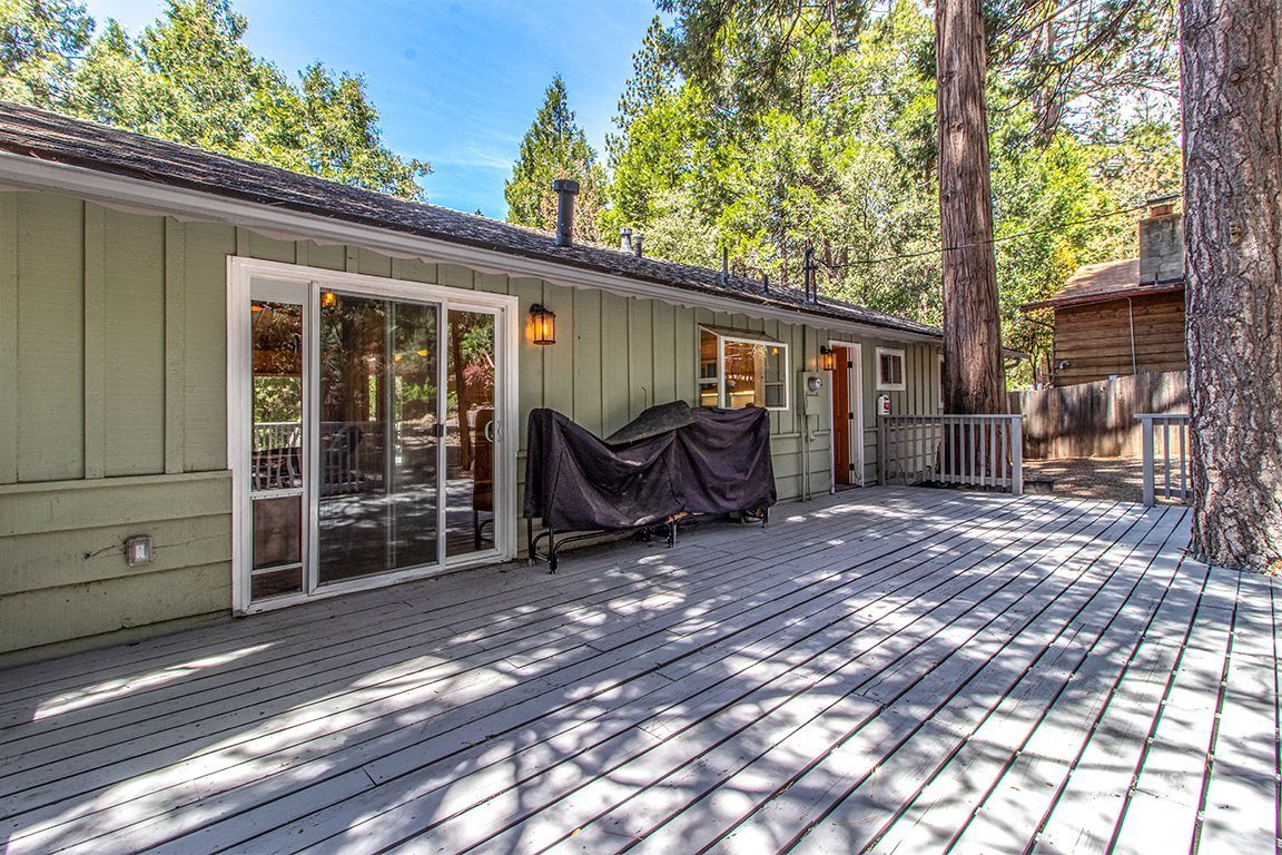 25104 Fern Valley Road Idyllwild, CA 92549 - Photo 38 of 55 a view of a house with backyard and a tree