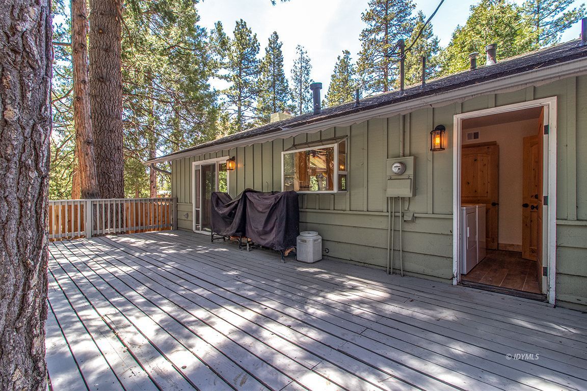 25104 Fern Valley Road Idyllwild, CA 92549 - Photo 39 of 55 a view of a house with a yard and wooden floor