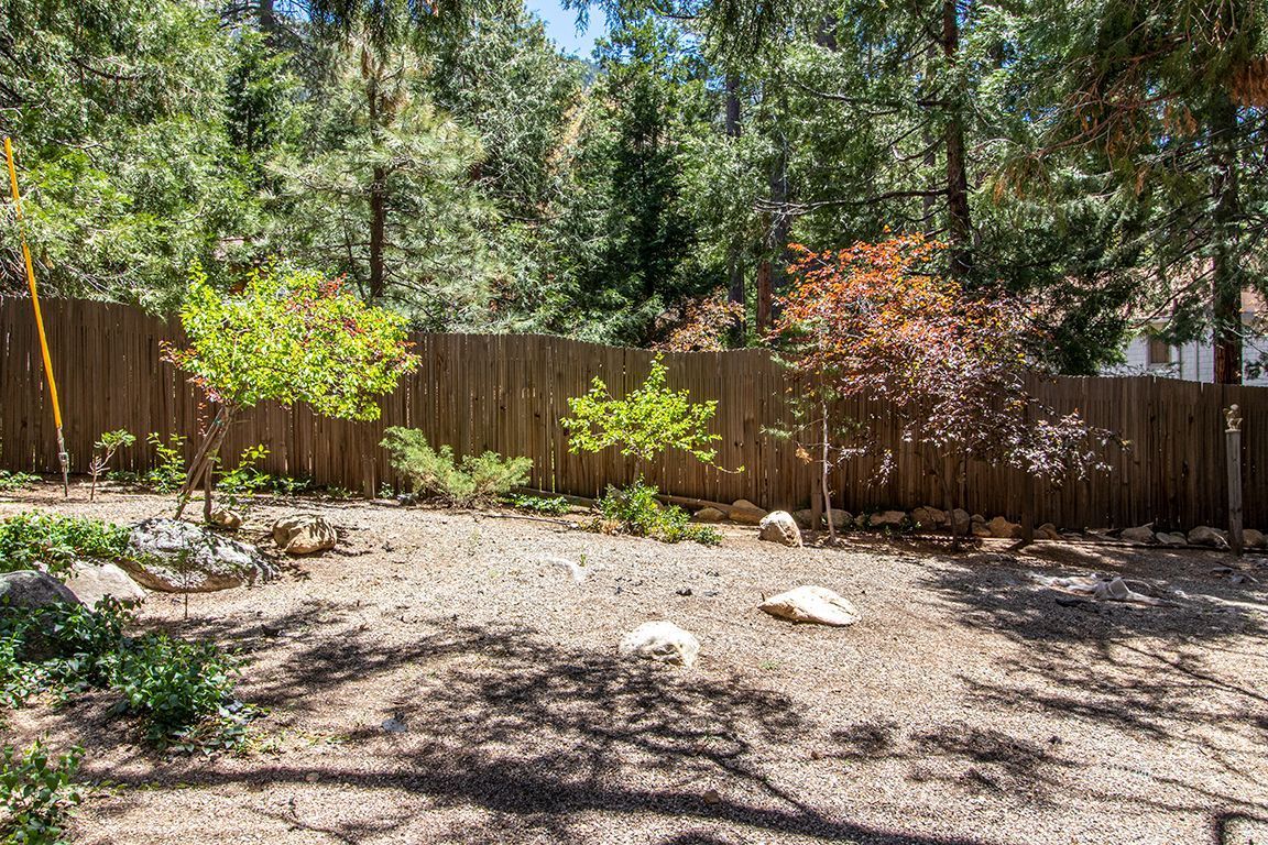 25104 Fern Valley Road Idyllwild, CA 92549 - Photo 41 of 55 a wooden bench with some trees