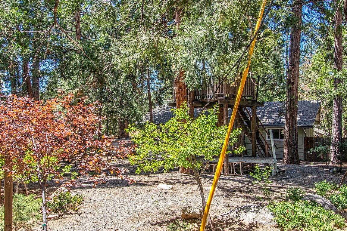 25104 Fern Valley Road Idyllwild, CA 92549 - Photo 42 of 55 a view of a table and chairs in the garden