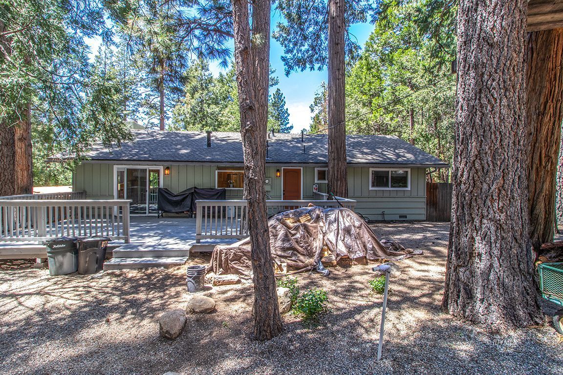 25104 Fern Valley Road Idyllwild, CA 92549 - Photo 45 of 55 a view of house with yard outdoor seating and trees