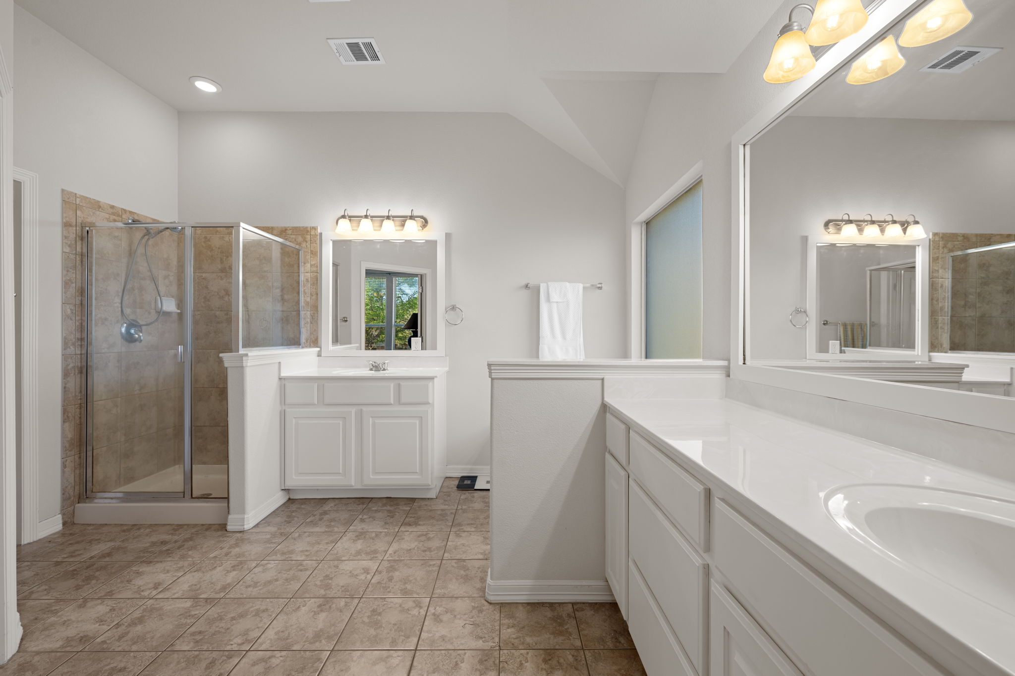 2221 Village View Loop Pflugerville, TX 78660 - Photo 15 of 25 a bathroom with a sink a vanity a mirror and a bathtub