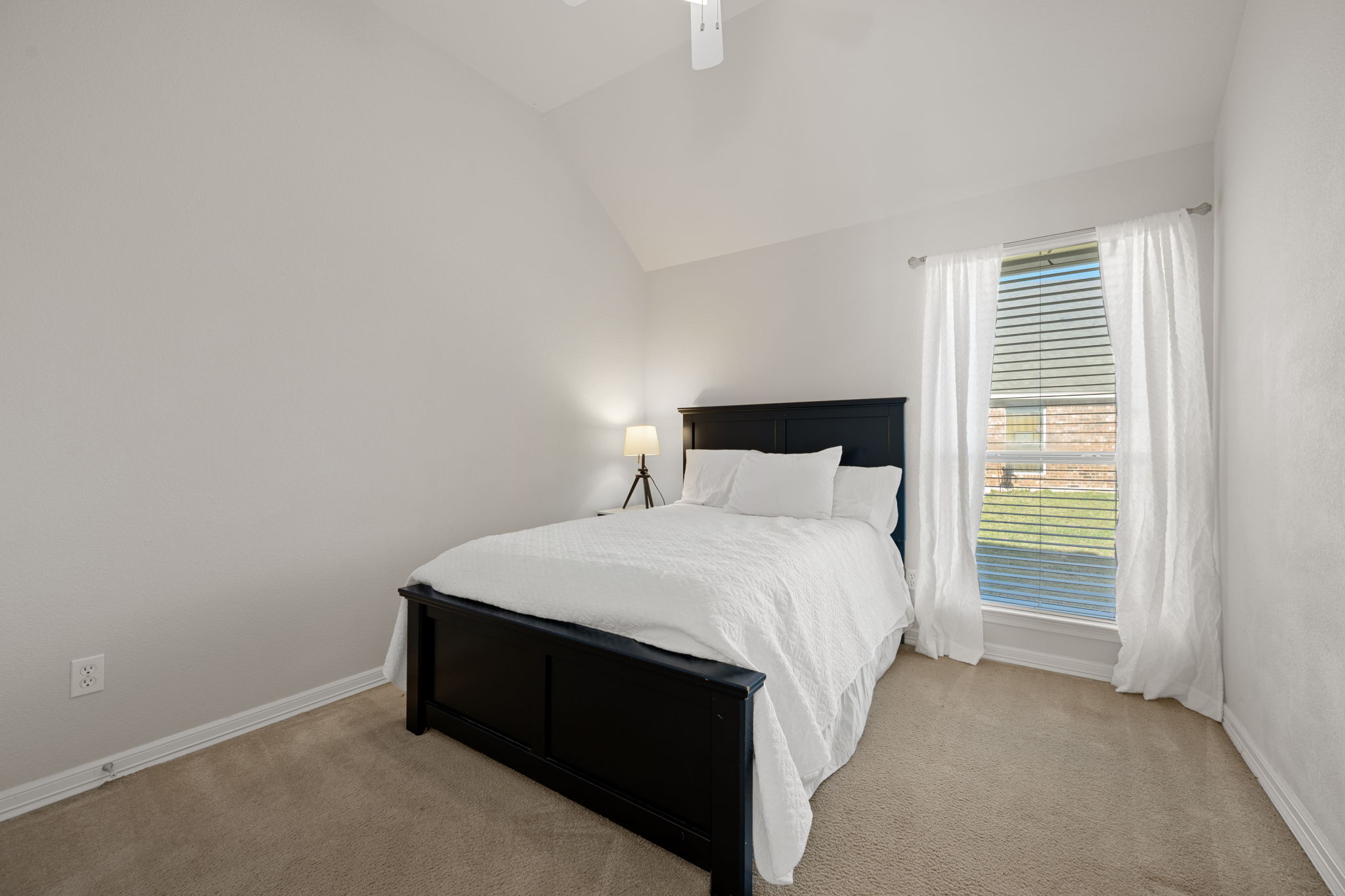 2221 Village View Loop Pflugerville, TX 78660 - Photo 18 of 25 a bedroom with a bed and a window