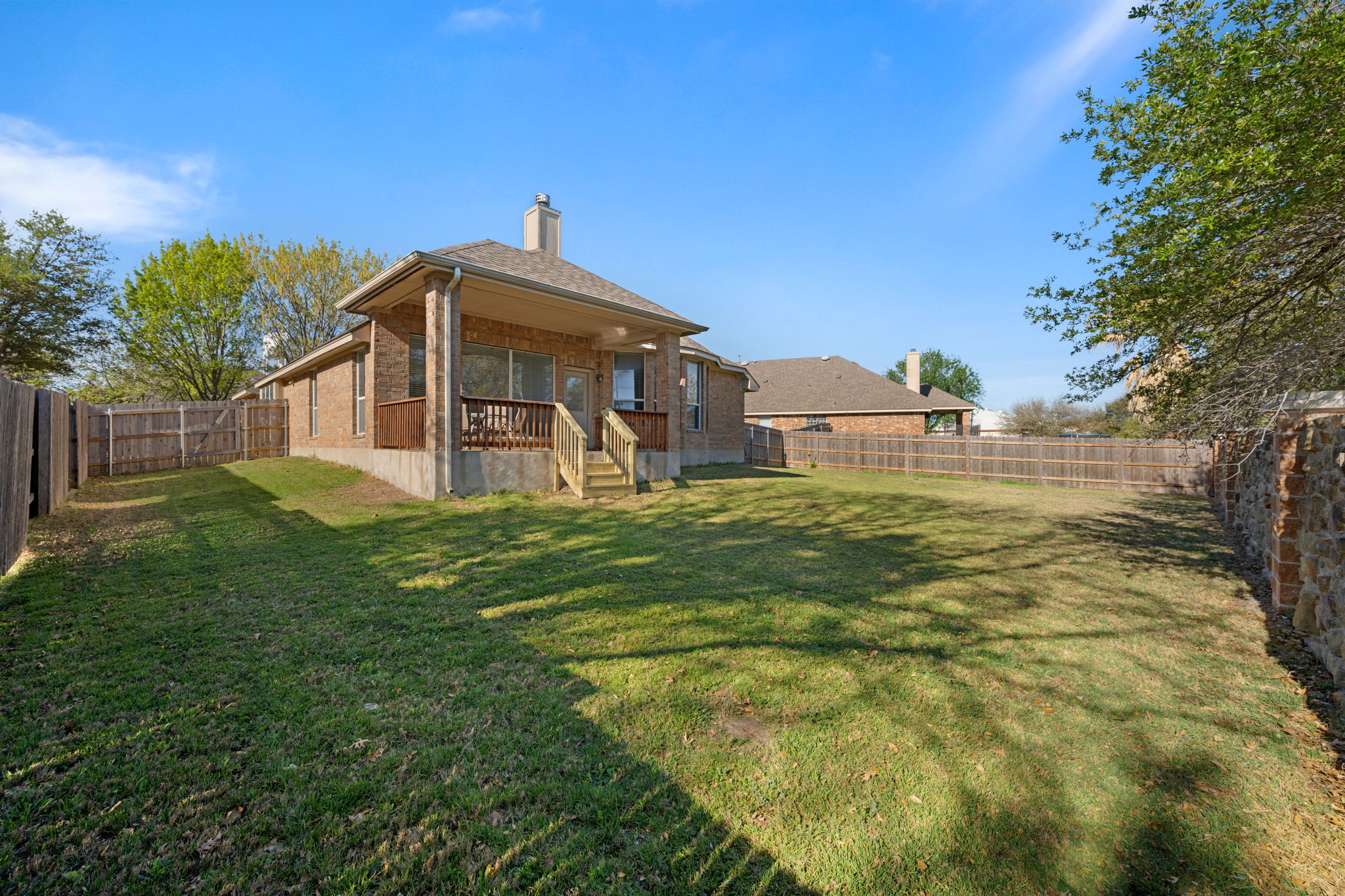 2221 Village View Loop Pflugerville, TX 78660 - Photo 19 of 25 a front view of a house with garden