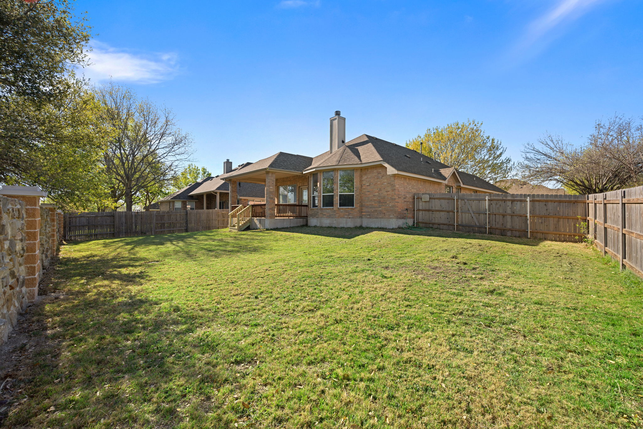 2221 Village View Loop Pflugerville, TX 78660 - Photo 20 of 25 a front view of a house with a yard