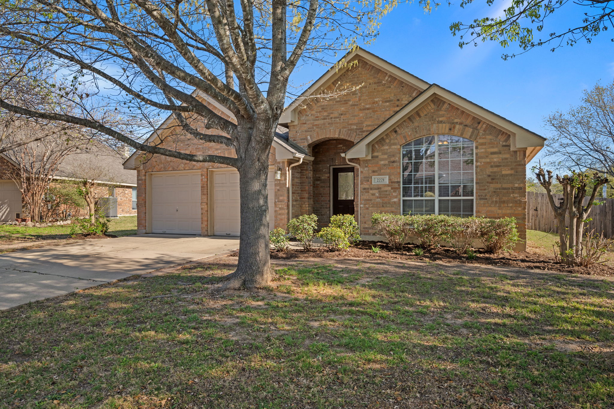 2221 Village View Loop Pflugerville, TX 78660 - Photo 2 of 25 a view of a house with a yard