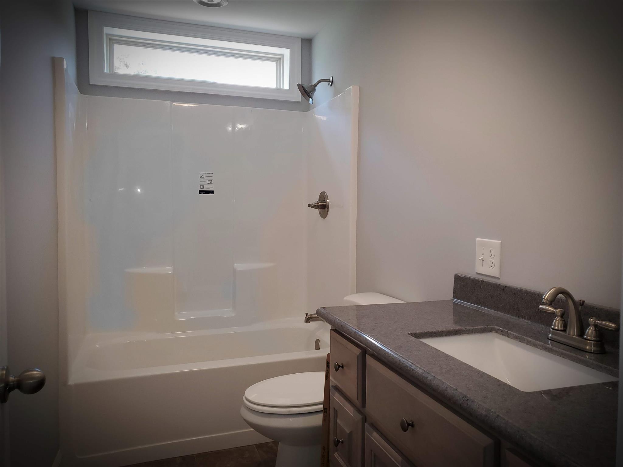 150 Morton Road Manchester, TN 37355 - Photo 4 of 17 Even the Hall Bath boasts of natural light. The vanities are custom made.
