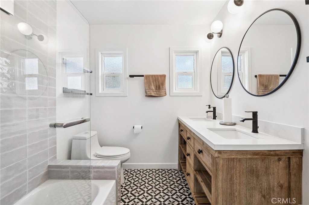 1448 Lemon Avenue Long Beach, CA 90813 - Photo 13 of 19 a bathroom with a sink a toilet and a mirror