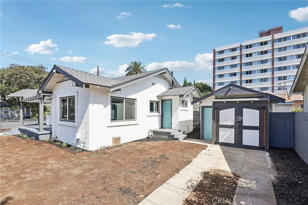 1448 Lemon Avenue Long Beach, CA 90813 - Photo 17 of 19 a front view of a house with a yard