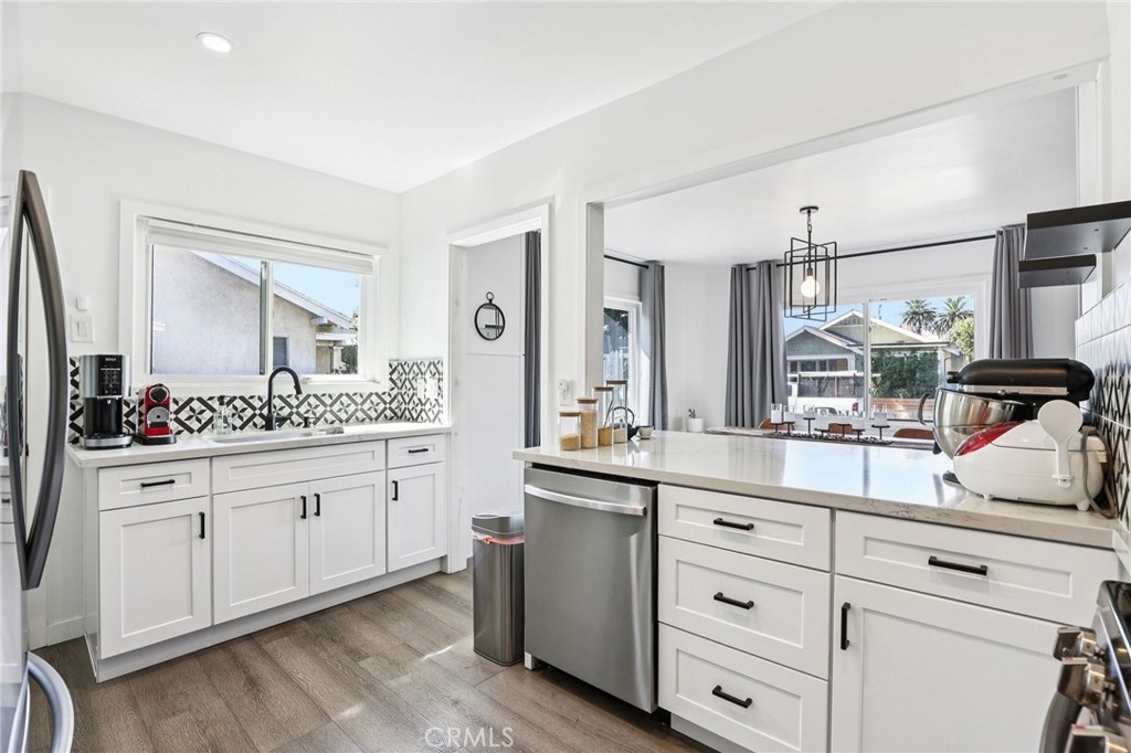 1448 Lemon Avenue Long Beach, CA 90813 - Photo 10 of 19 a kitchen with sink stove and cabinets