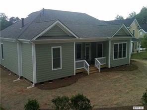 1066 Gardenia Street Fort Mill, SC 29708 - Photo 12 of 12 a view of a house with backyard space and wooden fence
