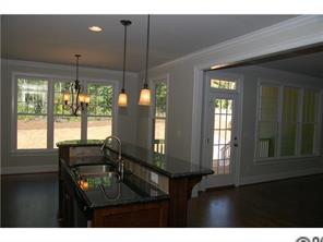 1066 Gardenia Street Fort Mill, SC 29708 - Photo 3 of 12 a living room with furniture and a chandelier