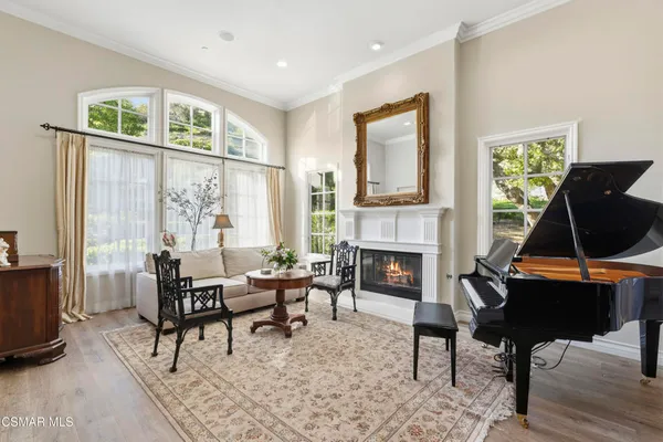 a living room with furniture a fireplace and a table
