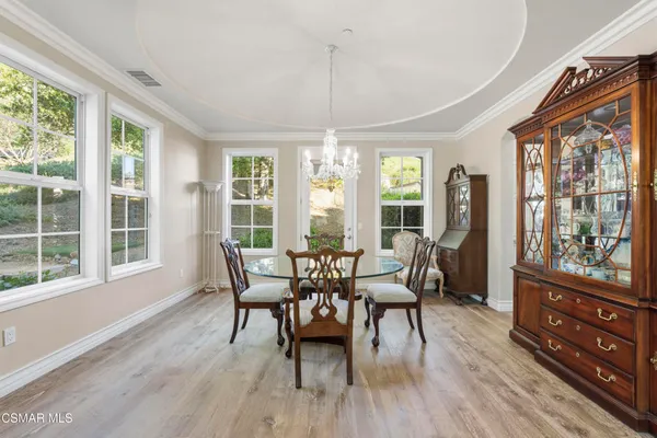 a dining room with furniture window wooden floor