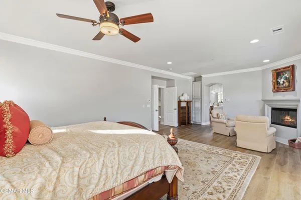a bed room with a bed and a chandelier