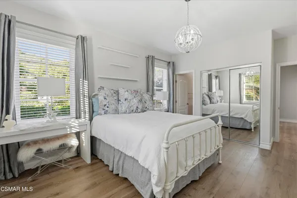 a bedroom with bed and a window