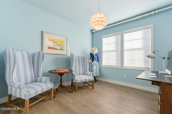 a bedroom with furniture and a window