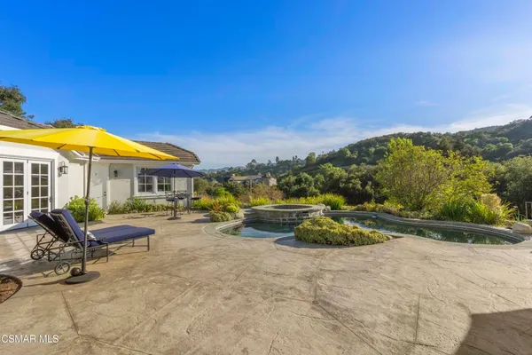 a view of a swimming pool with a patio
