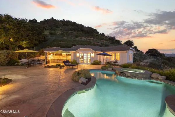a view of a swimming pool with a patio